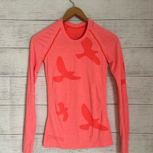 Oiselle Wing Out Fitted Long Sleeve Top in Bright Coral.